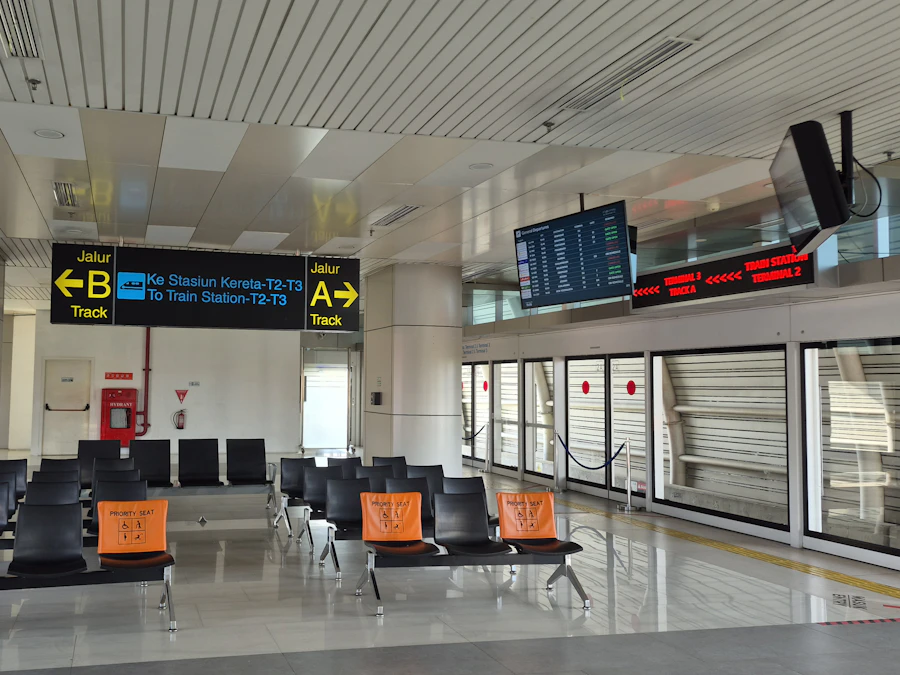 An empty airport waiting area with seating and departure displays
