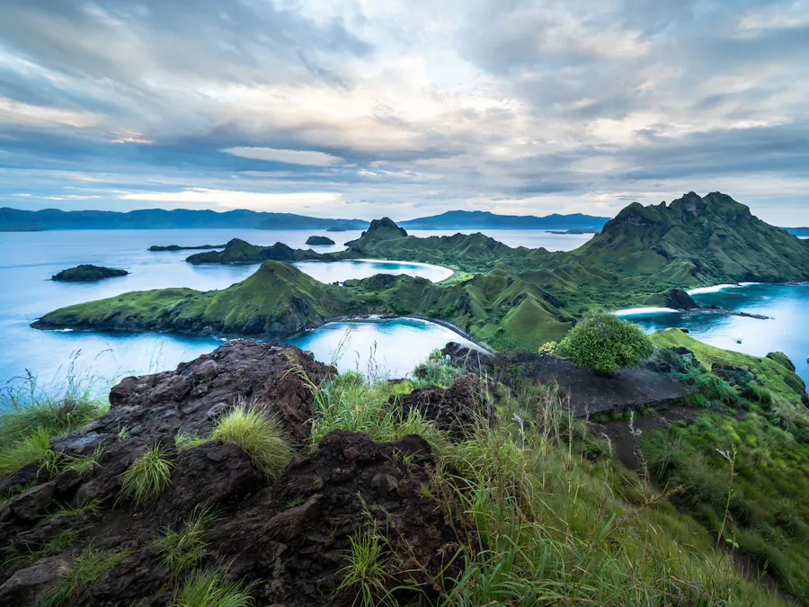 Green volcanic islands scattered across clear blue water