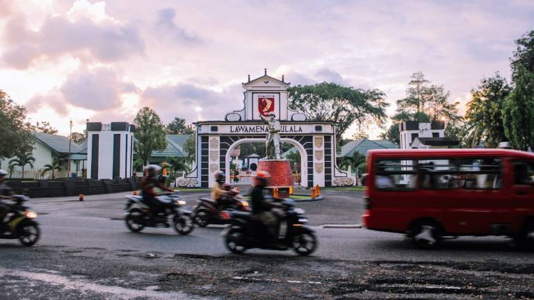 A colonial-era gateway on a street in eastern Indonesia